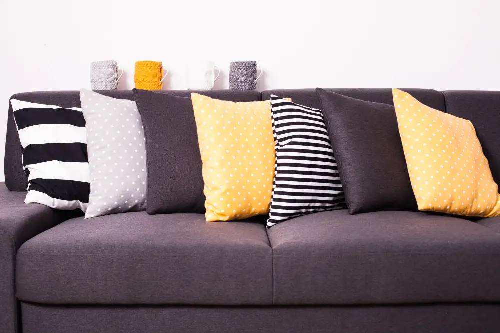 Gray Couch with colorful pillows