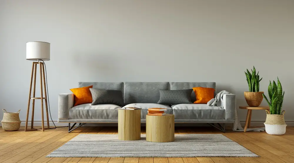 Gray Couch with orange pillows