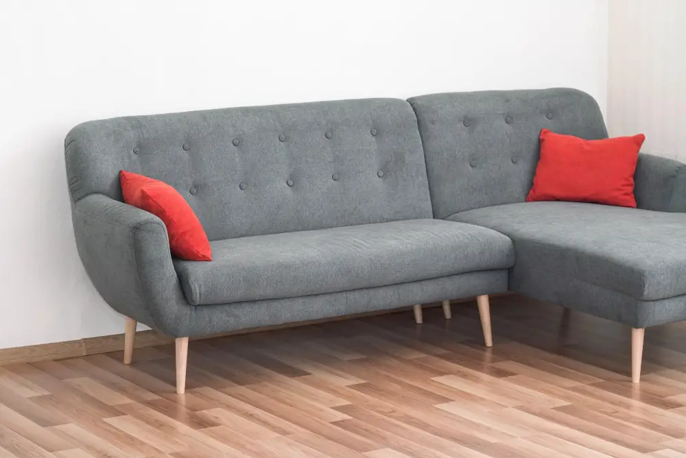 Gray Couch with red pillows