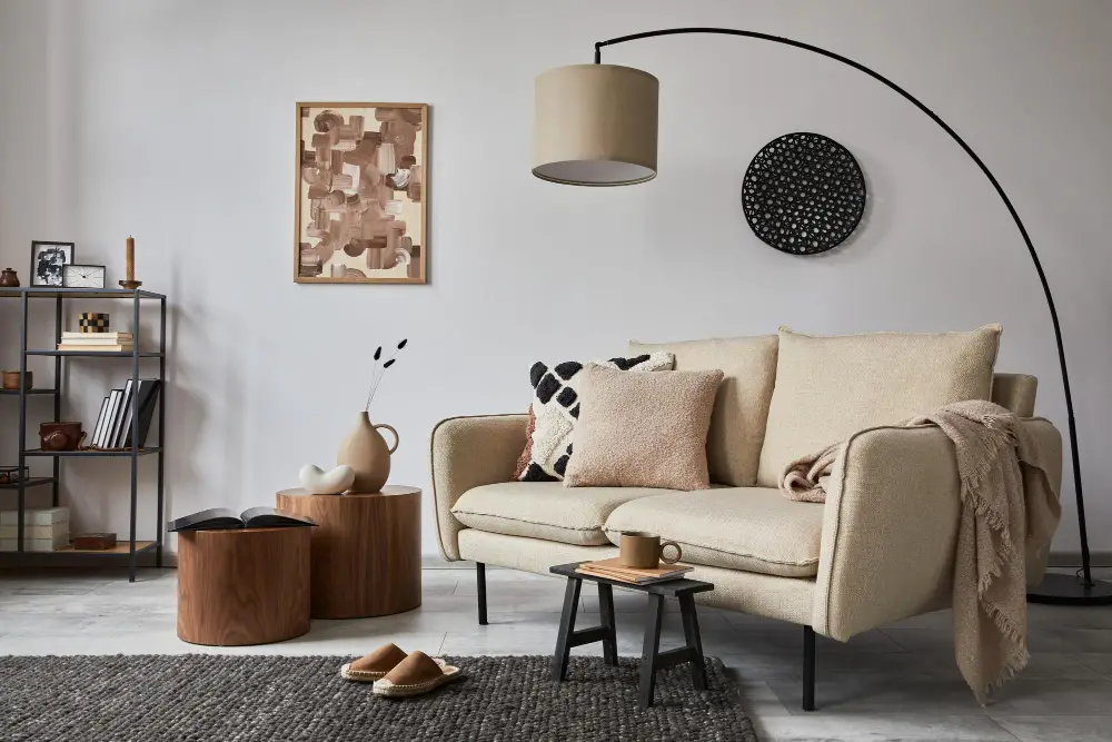 beige couch  with lamp