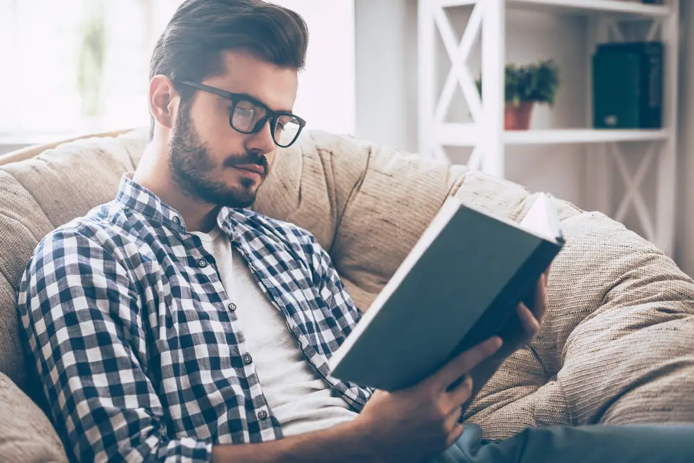 man reading book