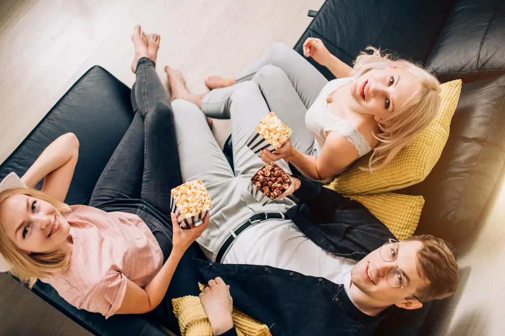 people sitting in a leather sofa