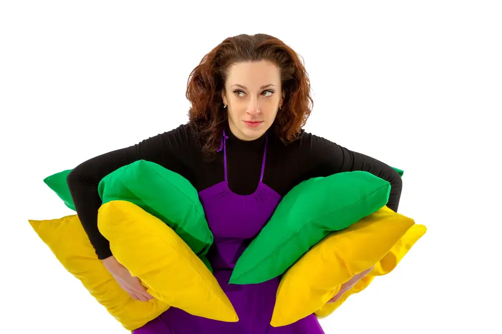 woman carrying cushions