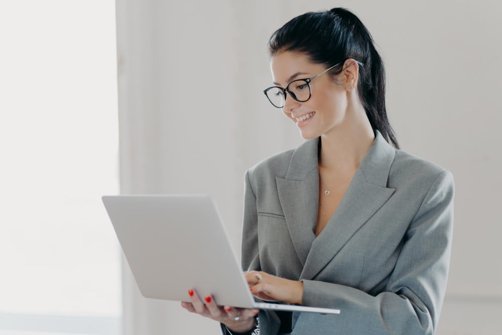 woman managing files in laptop