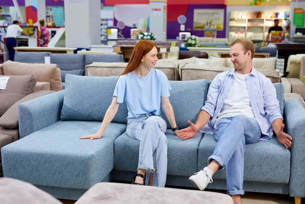 Couple Checking Sectional Sofa for Large Family