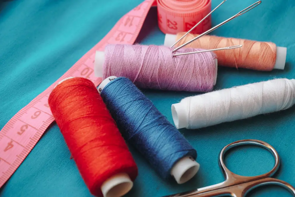 Sewing thread scissors needle measuring tape couch repair materials