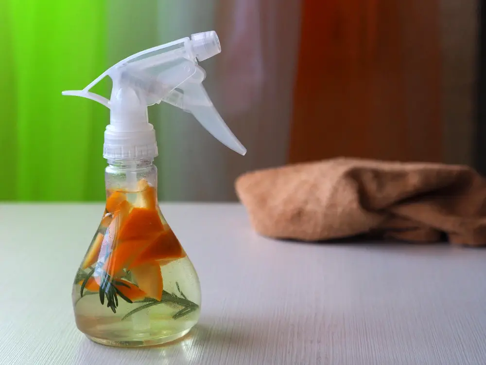 Spray bottle of rosemary and orange citrus flavored vinegar