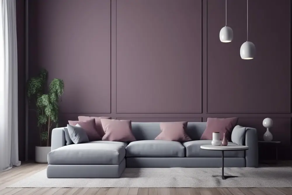 grey couch with a white table and a lamp purple wall pillows