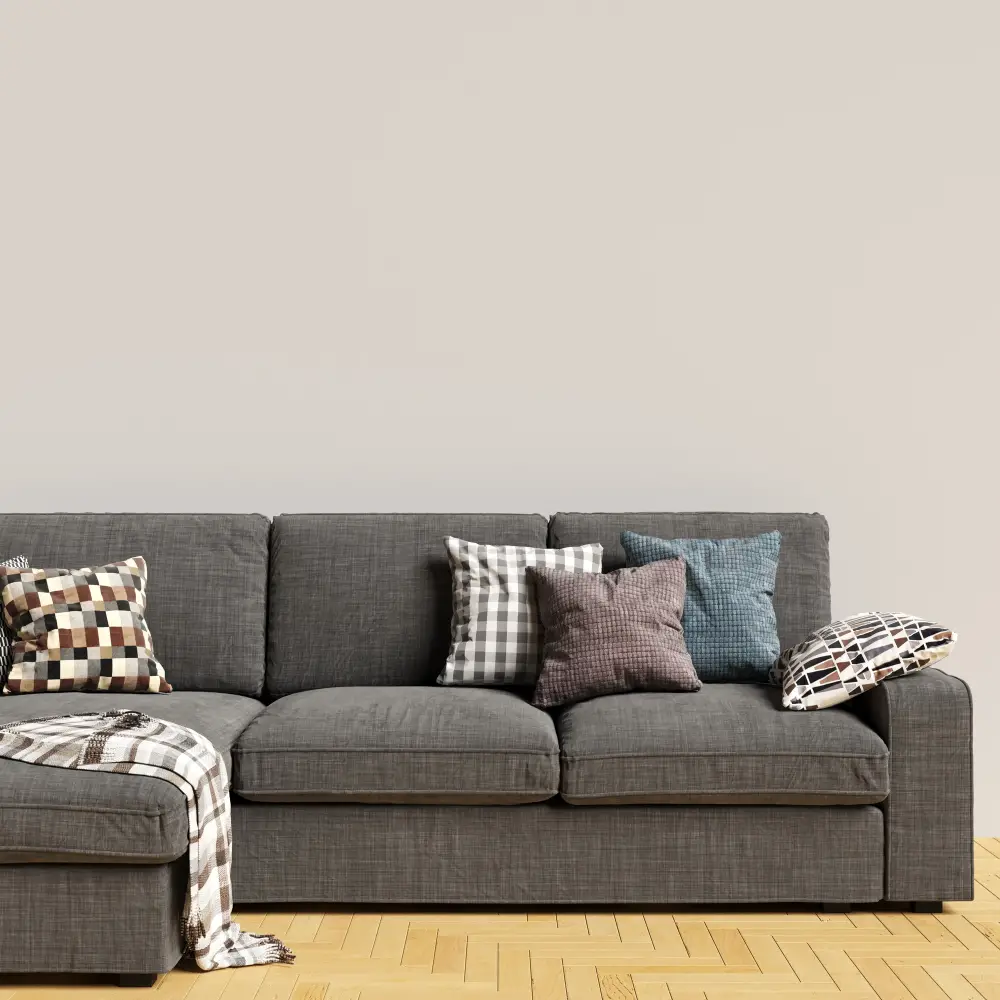 dark grey sofa couch with patterned pillows